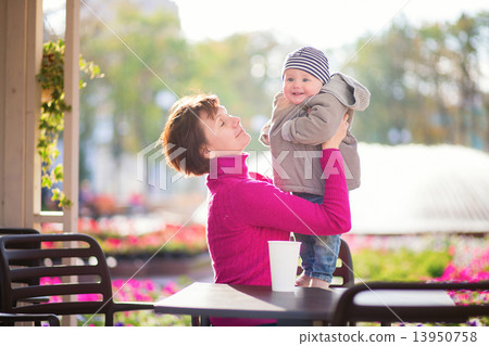 Middle aged woman and her little grandson 13950758