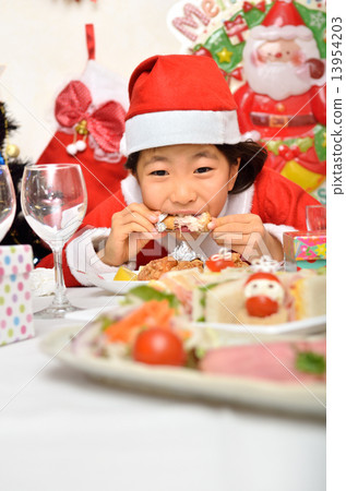 Santa Claus costume girls eating chicken Santa Claus costume girls eating chicken 13954203