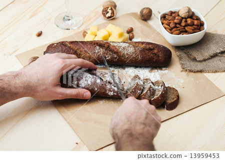 Sliced bread on the table with cheese and wine 13959453