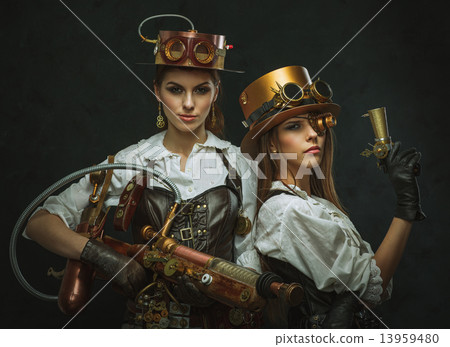 Two girls dressed in the style of steampunk with arms Two girls dressed in the style of steampunk with arms 13959480