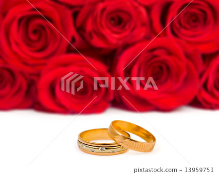Wedding rings and roses 13959751