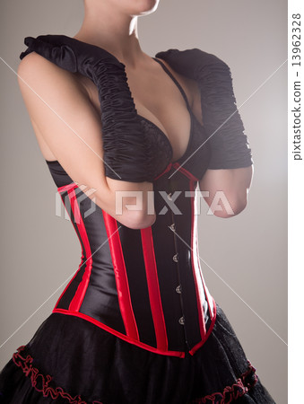 Young sexy woman in black and red corset Young sexy woman in black and red corset 13962328