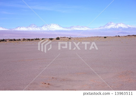 Andean mountain range of the early summer desired from the Valley of the Moon in the Atacama Desert spreading in the northern part of the Republic of Chile struck by strong South American sunlight 13963511