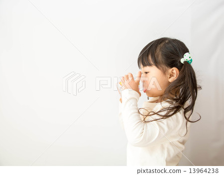 A girl drinking water with a cup 13964238