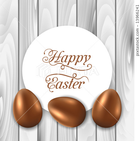 Celebration card with Easter chocolate eggs on wooden grey backg Celebration card with Easter chocolate eggs on wooden grey backg 13966241