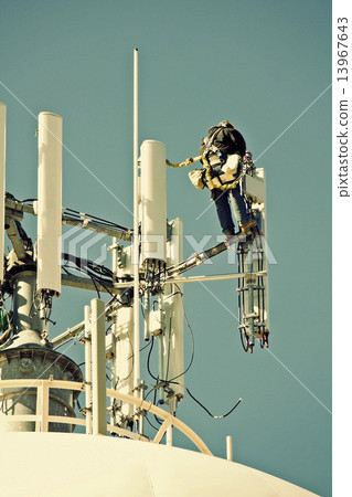 Crew working on the cell tower Crew working on the cell tower 13967643