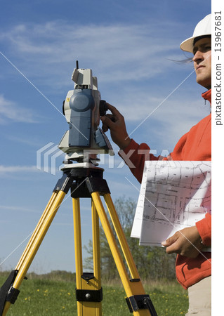 Land Surveyor in the field 13967681
