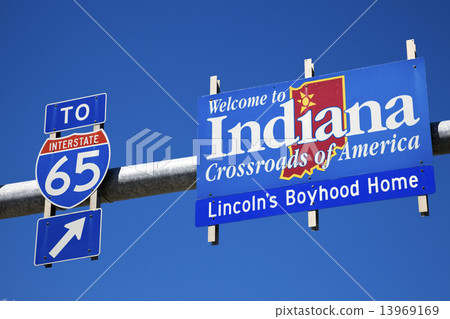 Welcome to Indiana road sign against blue sky. 13969169