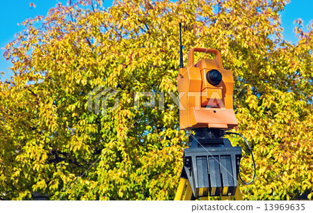 Surveying during colorful fall Surveying during colorful fall 13969635