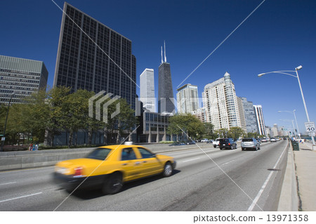 Yellow Taxi driving Lake Shore Drive 13971358