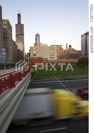 Blurred semi-truck driving in downtown Chicago Blurred semi-truck driving in downtown Chicago 13971503
