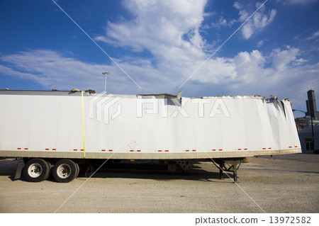 White trailer after accident against blue sky. 13972582