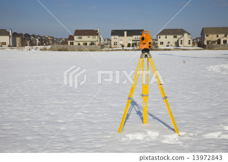 Orange theodolite set in the field Orange theodolite set in the field 13972843