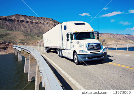 White Semi driving the bridge 13973060