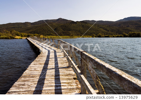 Isolated pier at Lake Taupo, New Zealand on a afternoon. Isolated pier at Lake Taupo, New Zealand on a afternoon. 13975629