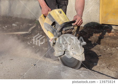 Construction site, worker cut asphalt with saw blade toll Construction site, worker cut asphalt with saw blade toll 13975814