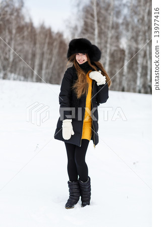 Portrait of young beautiful woman outdoor. 13977416
