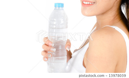 sporty woman drinking water, isolated against white background sporty woman drinking water, isolated against white background 13978039