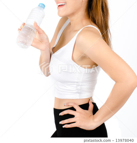 sporty woman drinking water, isolated against white background 13978040