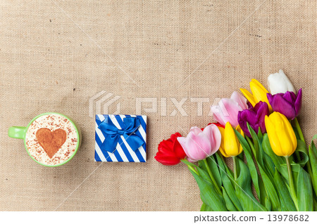Cappuccino and gift box near flowers Cappuccino and gift box near flowers 13978682