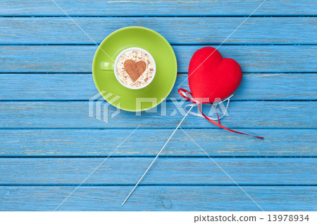 Cup of Cappuccino with heart shape symbol and toy Cup of Cappuccino with heart shape symbol and toy 13978934