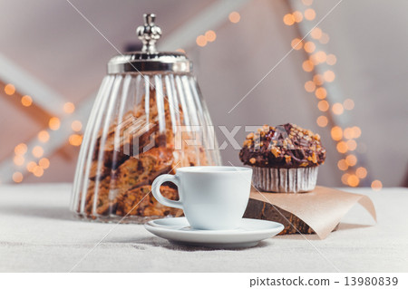 composition  the table with a cup of coffee and pchenem on  light background 13980839