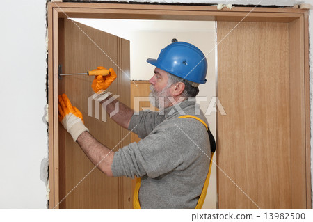 Worker install new door 13982500
