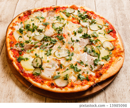 pizza on the wood background 13985098