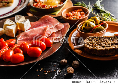 Spanish dinner cooked and served on the table 13986318