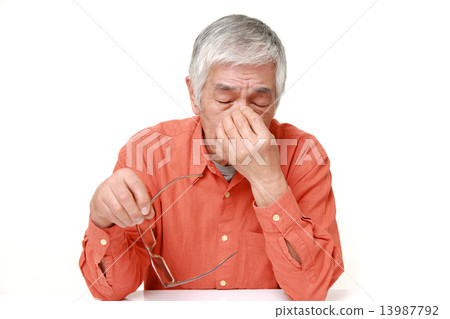 Elderly with tired eyes 13987792