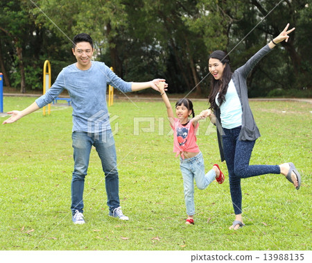 Family playing at park  13988135