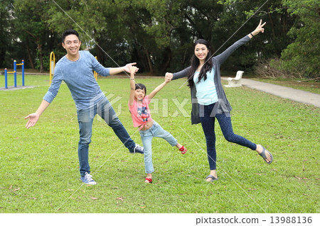 Family playing at park  13988136