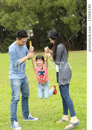 Family playing at park  13988140