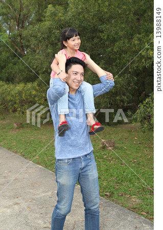 Father and daughter piggybak at park Father and daughter piggybak at park 13988149