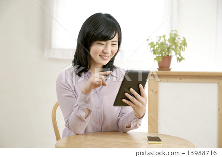 Tablet and young lady Tablet and young lady 13988716