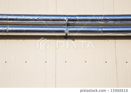 Metal chrome pipes on siding wall 13988818