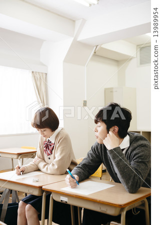 Male student cheating 13989954