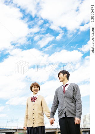 Student couple connecting hands 13990471
