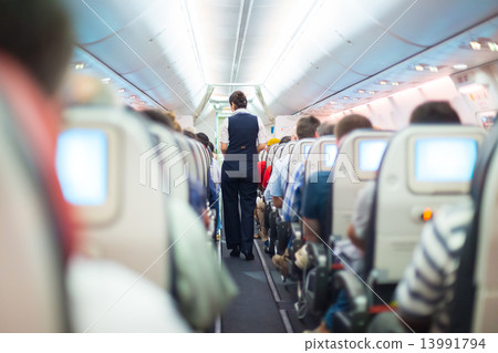Stewardess on the airplane. 13991794