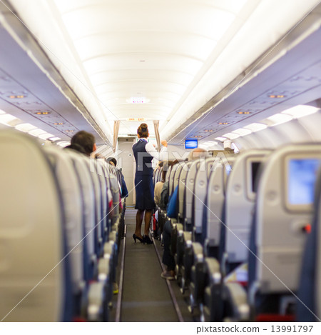 Stewardess on the airplane. 13991797