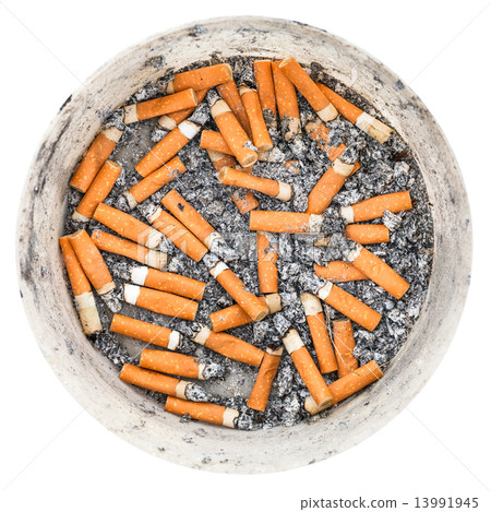many cigarette ends in plastic ashtray isolated many cigarette ends in plastic ashtray isolated 13991945