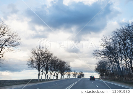 gray rainy clouds over highway in early spring 13991980
