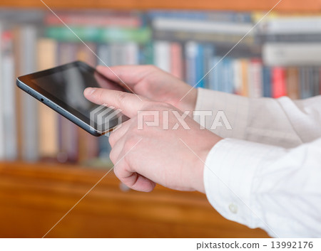 businessman finger pressing tablet pc screen businessman finger pressing tablet pc screen 13992176