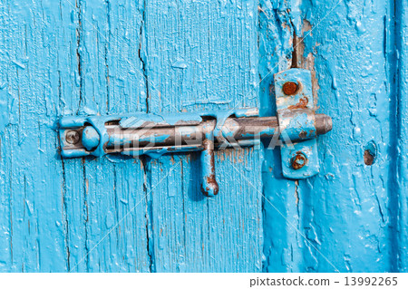 Espagnolette on old blue painted door Espagnolette on old blue painted door 13992265