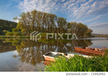 Fishing punts on the river 13992602