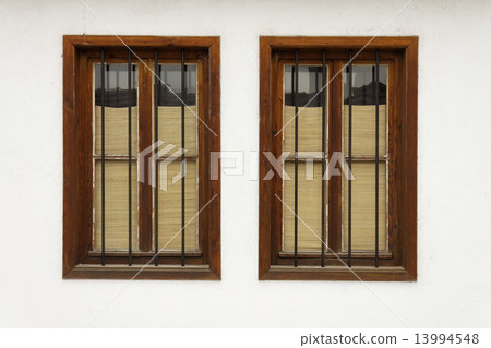 Two bulgarian old windows on white wall 13994548