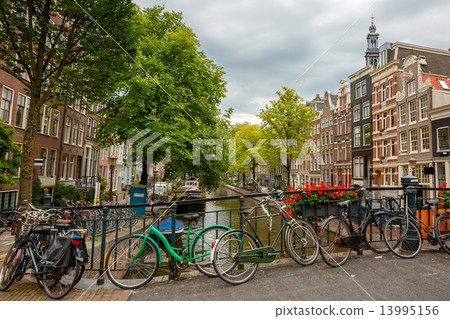 City view of Amsterdam canals and typical houses, Holland, Nethe City view of Amsterdam canals and typical houses, Holland, Nethe 13995156