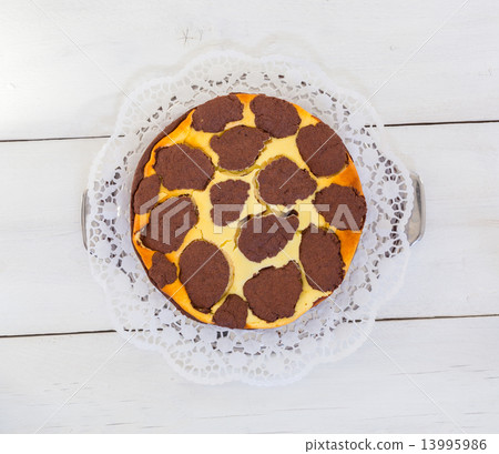 Russian chocolate cheesecake on white wooden background. Russian chocolate cheesecake on white wooden background. 13995986