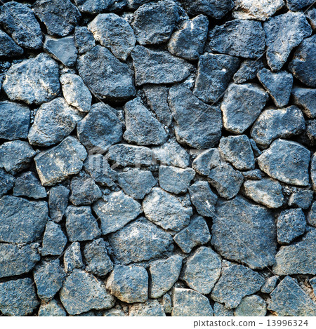 volcanic pumice rock wall background. 13996324