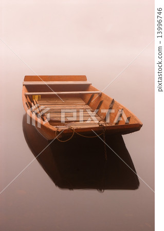 Fishing punt in the mist on the river at sunrise 13996746